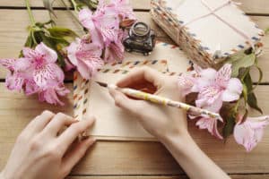 write a letter or on a postcard