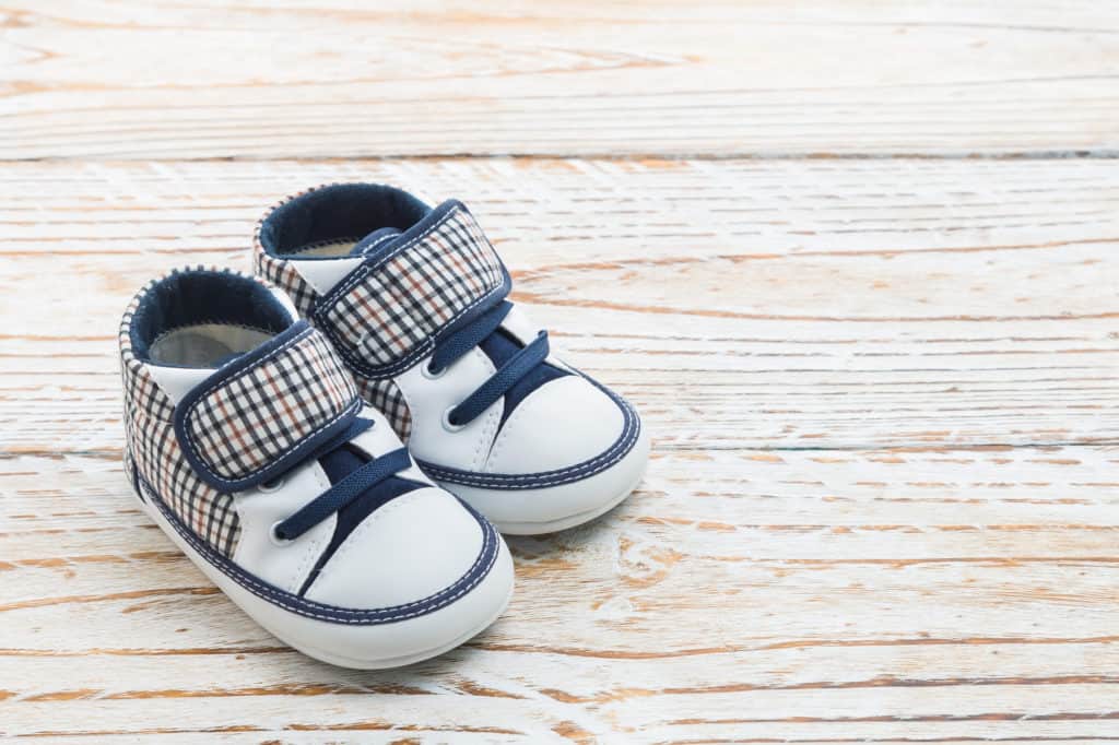 place baby shoes at his front door