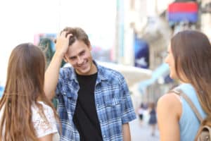 flirt with other people to make him or her jealous